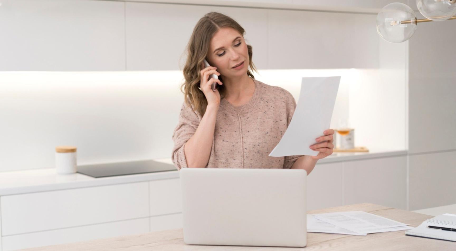Professional studying financial documents with focused concentration